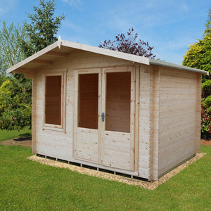 Shire 11x8 Berryfield Log Cabin on gravel base surrounded by lawn and trees in background